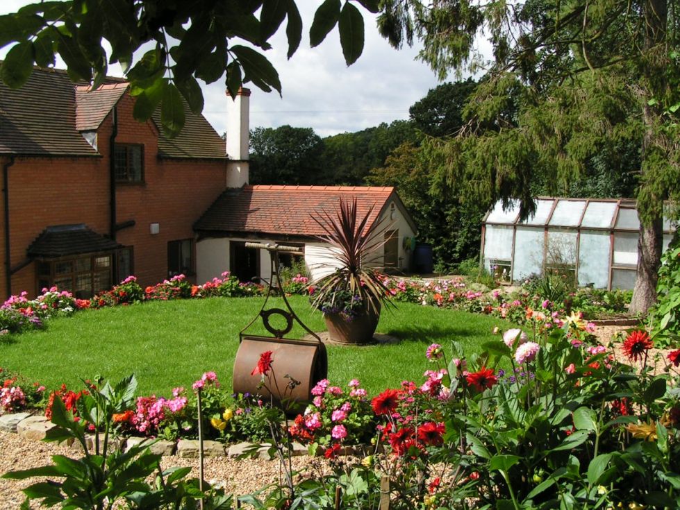 Garden Landscaping - round garden with roller on lawn