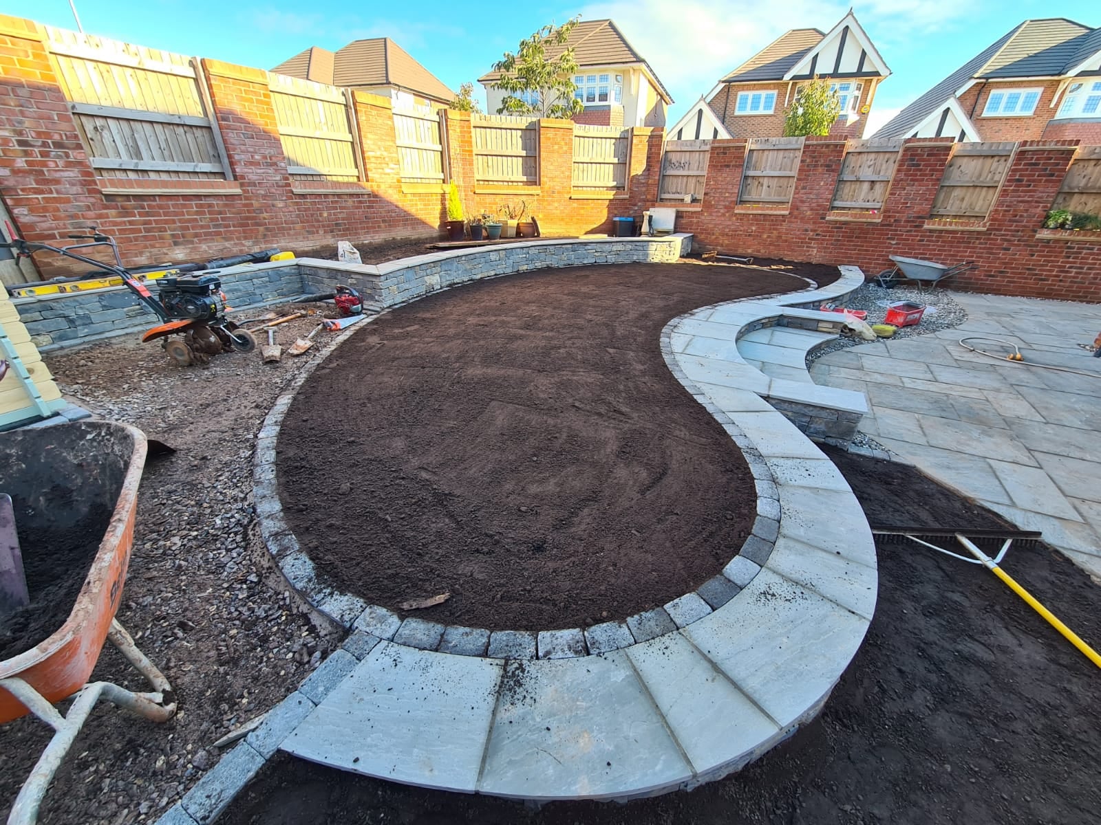 Boomerang Lawn Case Study - During - Soil laid within stone foundations