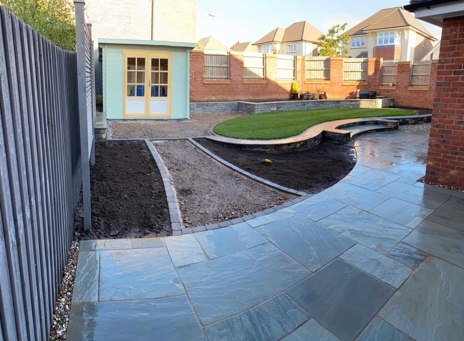 Boomerang Lawn - During - Pathway laid and shed installed