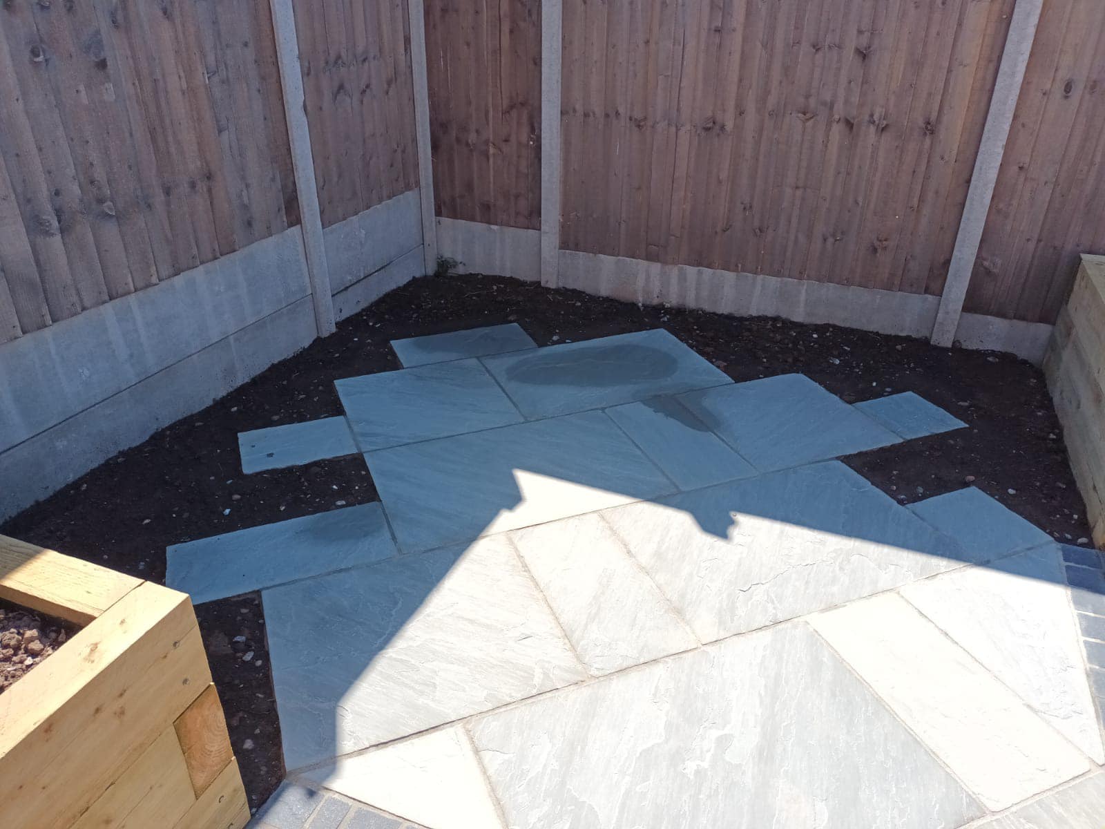 Cottage Garden in Suburbia Case Study - During - high shine stones laid in corner of garden