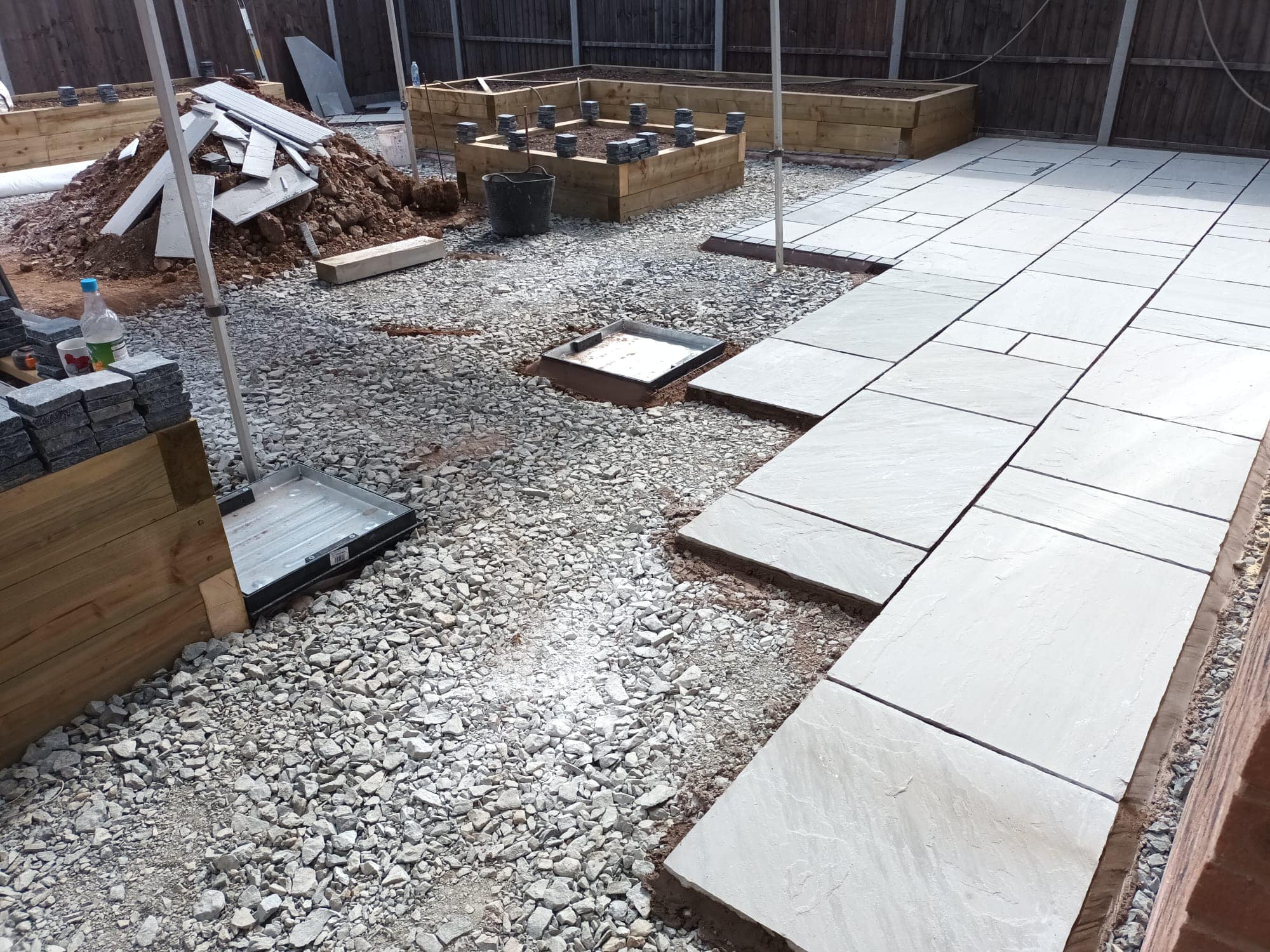 Cottage of Suburbia - During - stone tiles being laid for patio
