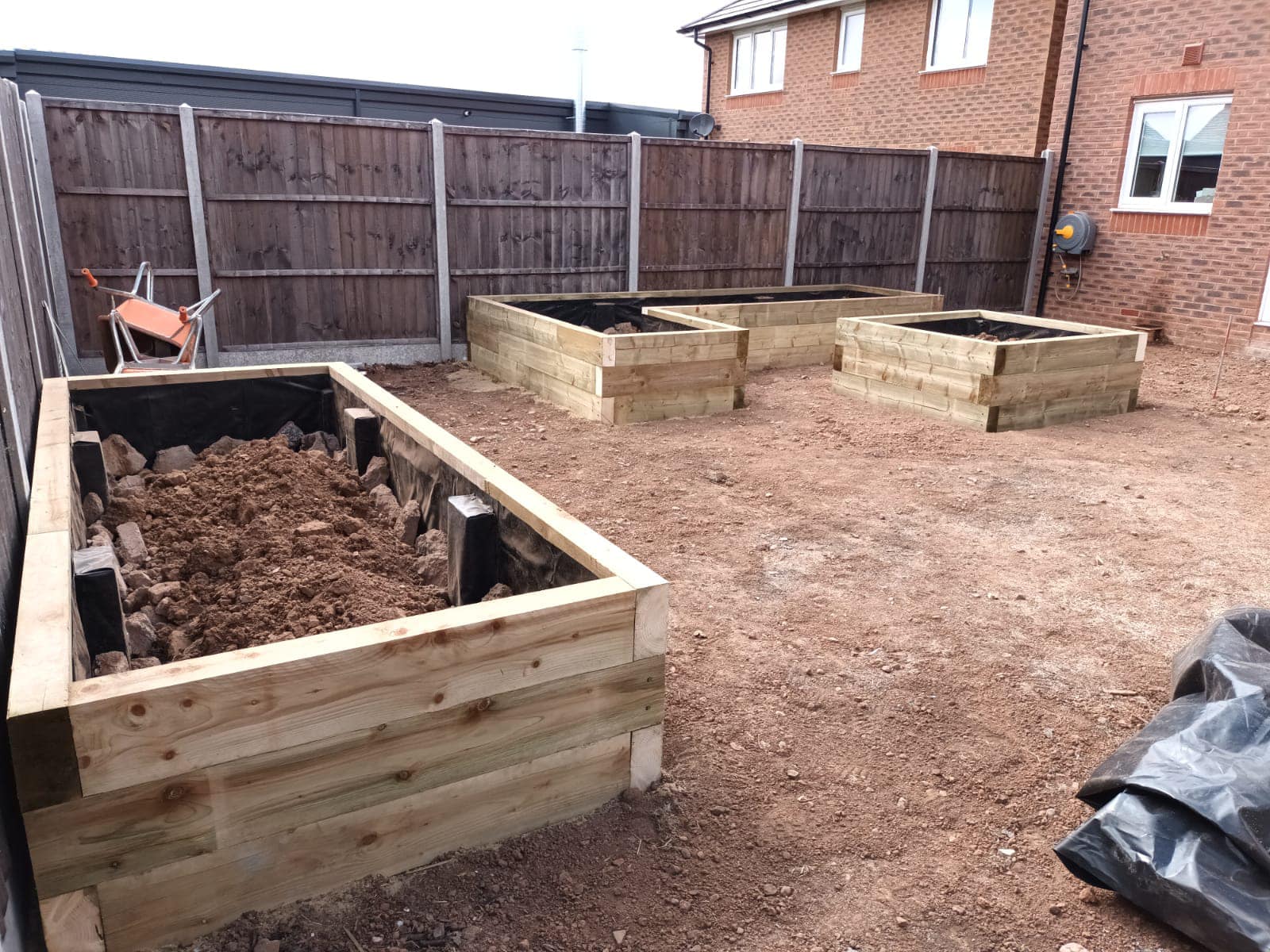 Cottage of Suburbia - During - Raised beds being filled with soil
