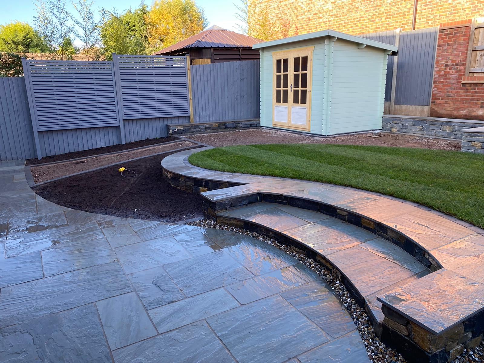Boomerang Lawn - During - laying stone surrounds