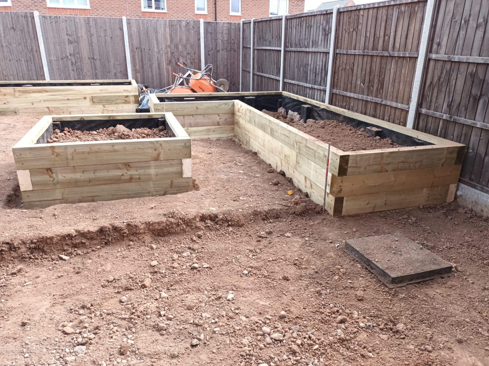 Cottage of Suburbia - During - Raised beds being laid with soil