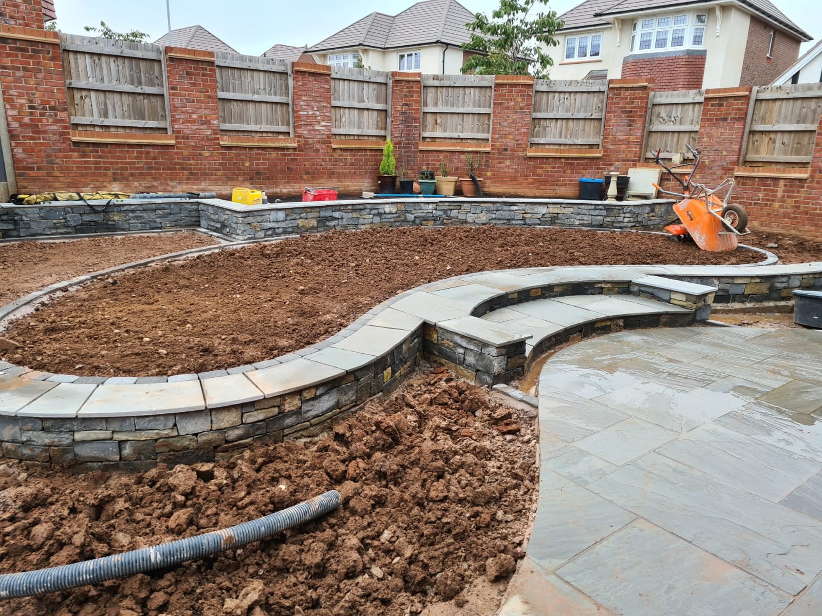 Boomerang Lawn - During - stone edging laid